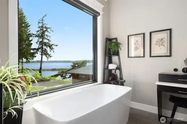 Revel in the tranquility of a spa soaking bath framed by nature views, providing a tranquil retreat for rejuvenation and relaxation. This space is not just a bathroom; it’s a personal spa experience that awaits, day or night.