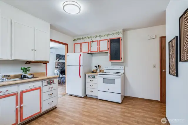 To the right is a walk-in pantry, two bedrooms, and the full bath and half bath.