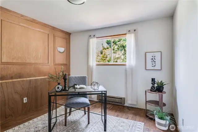 This middle bedroom has sweet built-ins that add charm to the space. This is an ideal spot for a home office.