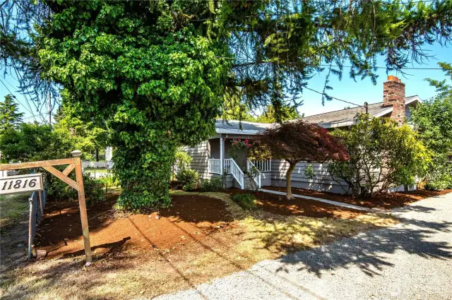 The home is situated on a level lot, with lovely mature landscaping all around.