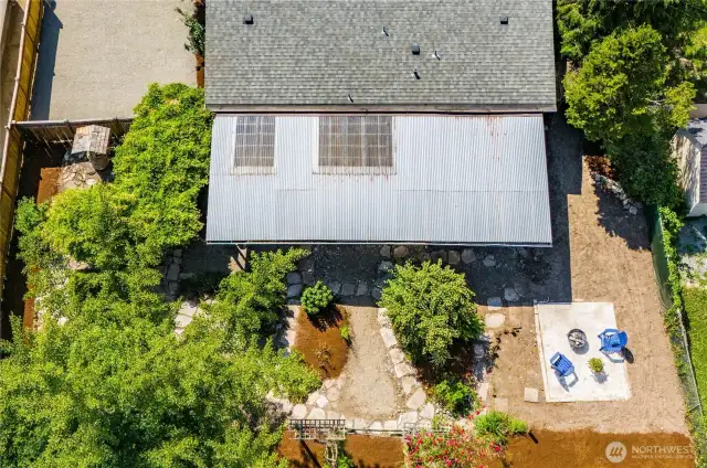 This aerial perspective shows the layout of the backyard of the property.