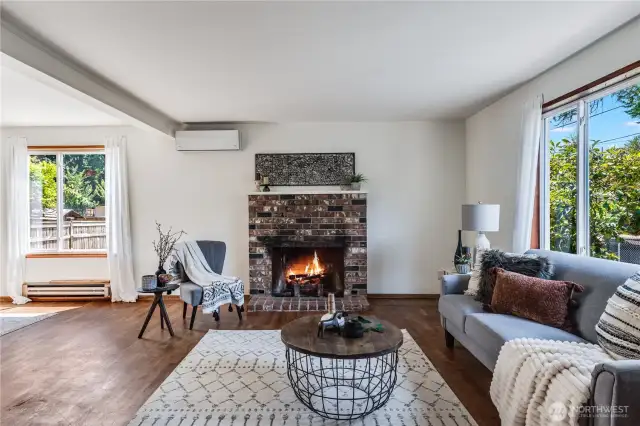 The wood burning fireplace is a cozy centerpiece of the living room.