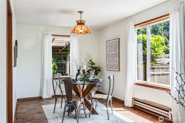 Abundant natural light fills the dining room, which looks out to the backyard.
