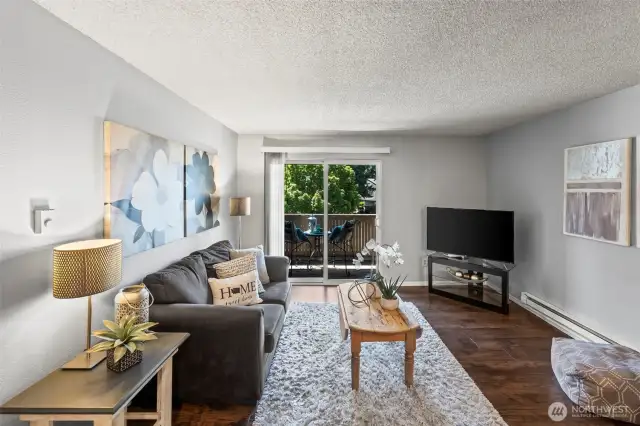 Living room has ample space, newer lvp flooring and electric heat.
