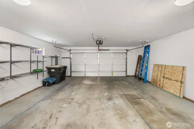 Oversized garage with built-in shelves for extra storage