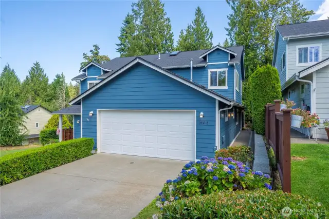 Lush, established landscaping offers a warm welcome