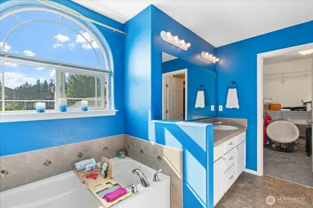 Soaking tub and spacious walk- in closet