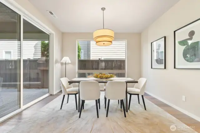 Formal dining with huge glass door to outdoor room.