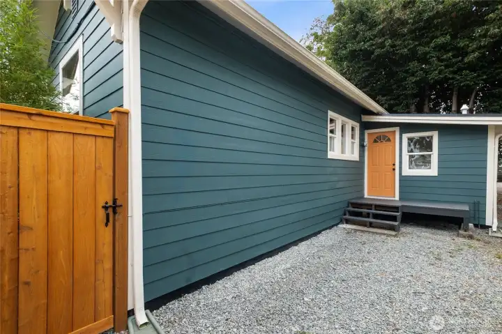 Rear of house with parking area, also suitable for a new deck.
