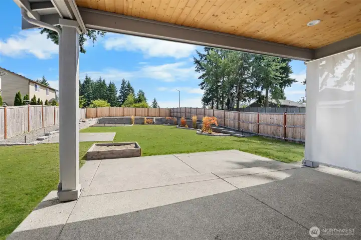Enjoy the outdoors year round on the patio, beneath beautiful pine tongue and groove ceilings with recessed lighting.