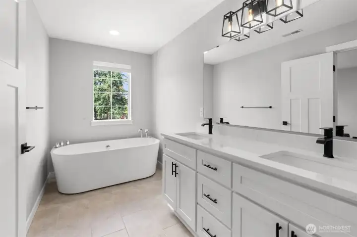 Unwind in your personal jetted tub! Tile flooring is another thoughtful design in the primary bathroom.
