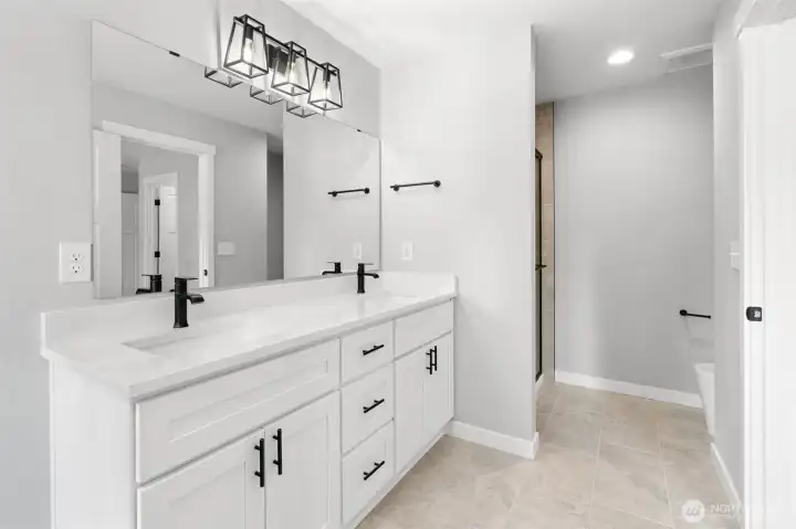 The dual sink vanity offers functionality and storage.