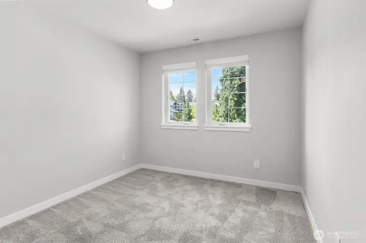 Each of the additional bedrooms have top quality carpeting and abundant natural light.