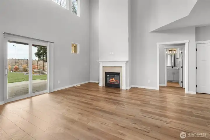 The lower level features a bedroom just beyond the fireplace, as well as a full bathroom.