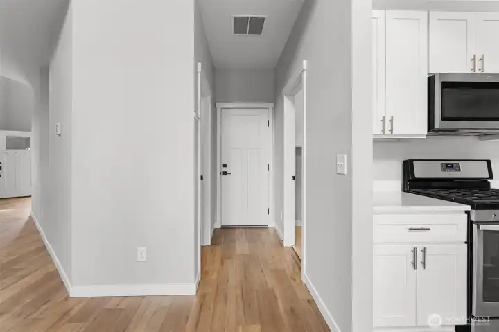 Access from the garage is conveniently located next to the utility room, walk in storage closet, and pantry.
