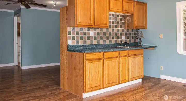 Kitchenette looking to full bath at back