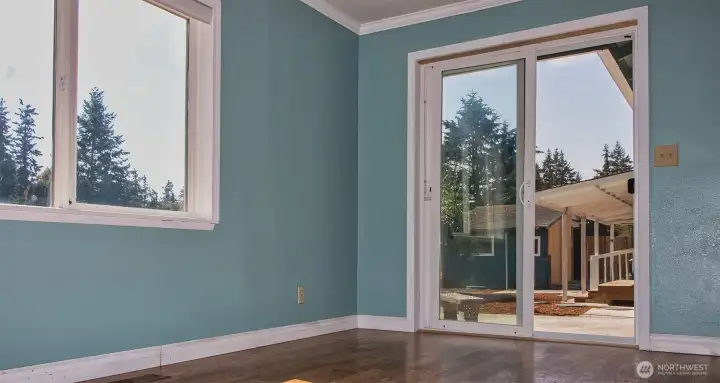 Sliders to patio as separate back entry to addition - large fenced back yard is delightful.