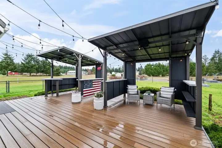 This deck is the perfect place to grill, complete with bistro lights for ambiance