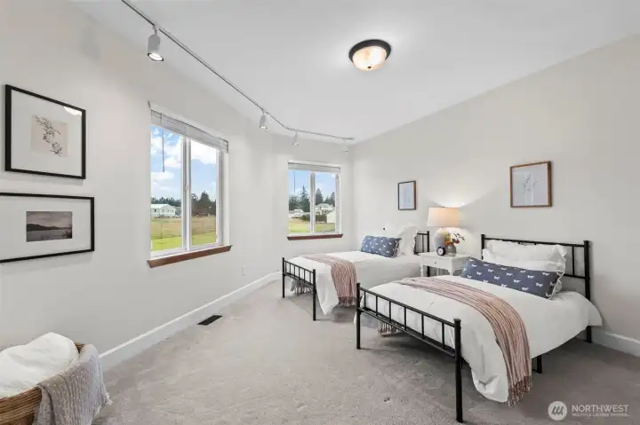 On the opposite wing from the primary you'll find two more bedrooms