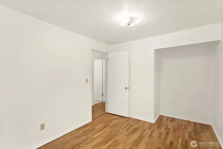 In this 3 bedroom, 1.5 bathroom home you'll see hardwoods in all 3.  The closet is open, no doors so you can choose what shelving and doors you'd like.