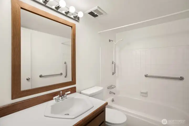 The guest bath features a full tub/shower combo and plenty of storage.