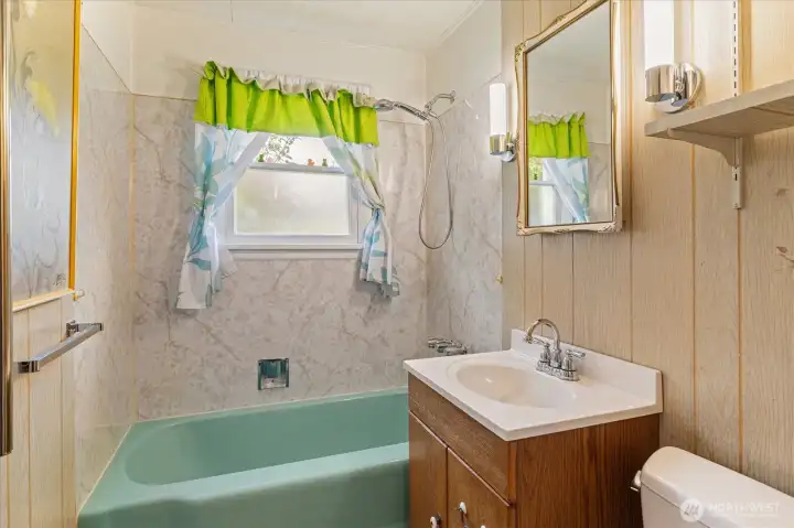 full bath with periwinkle tub