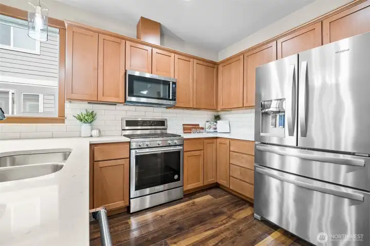 Kitchen with stainless steel appliance