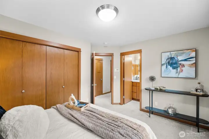 Primary Bedroom with Closet, Primary Bathroom and hallway