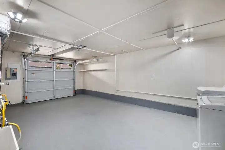 Attached garage offers storage for cars, bikes and tools.