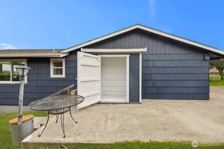 Wide driveway provides extra parking with easy access to more storage.