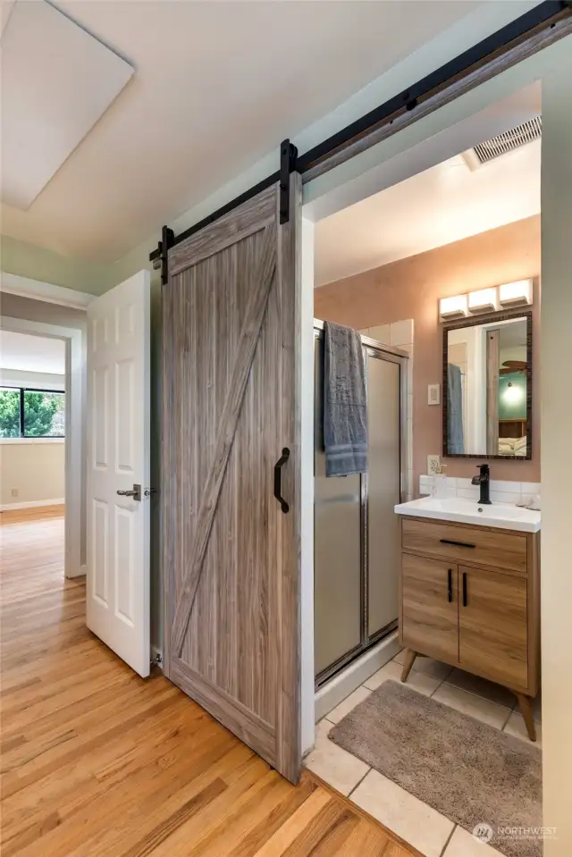 Barn door to primary bathroom