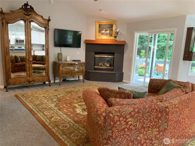 Family room with doors leading to covered deck