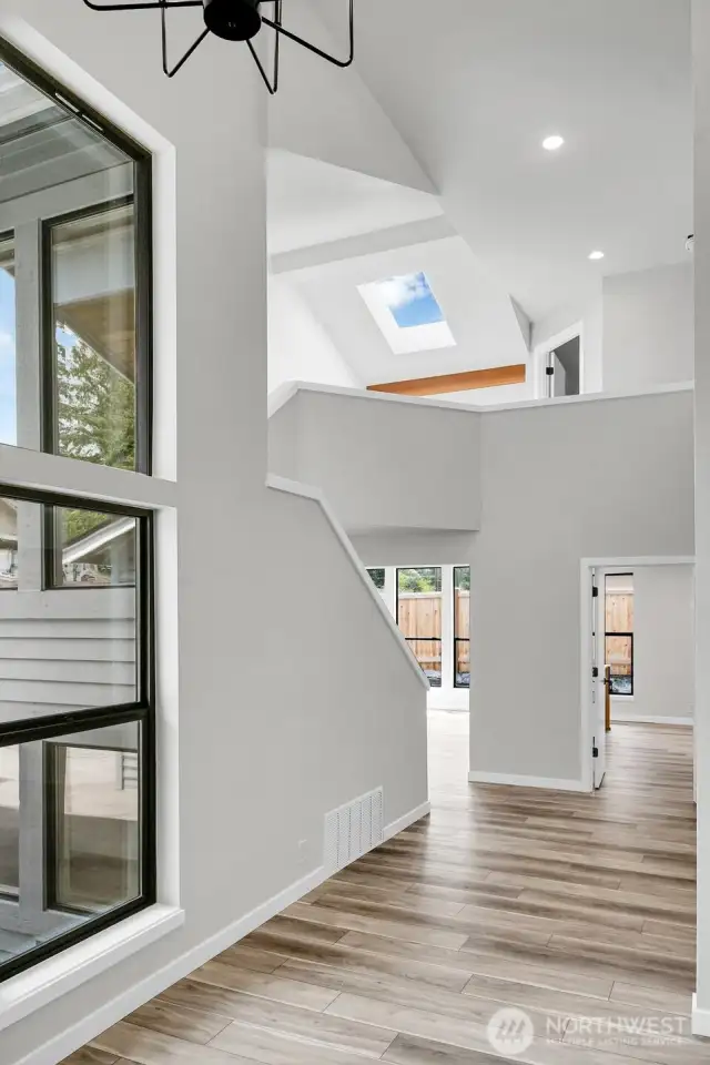 Vaulted entry showcases all the great angles of this original home.