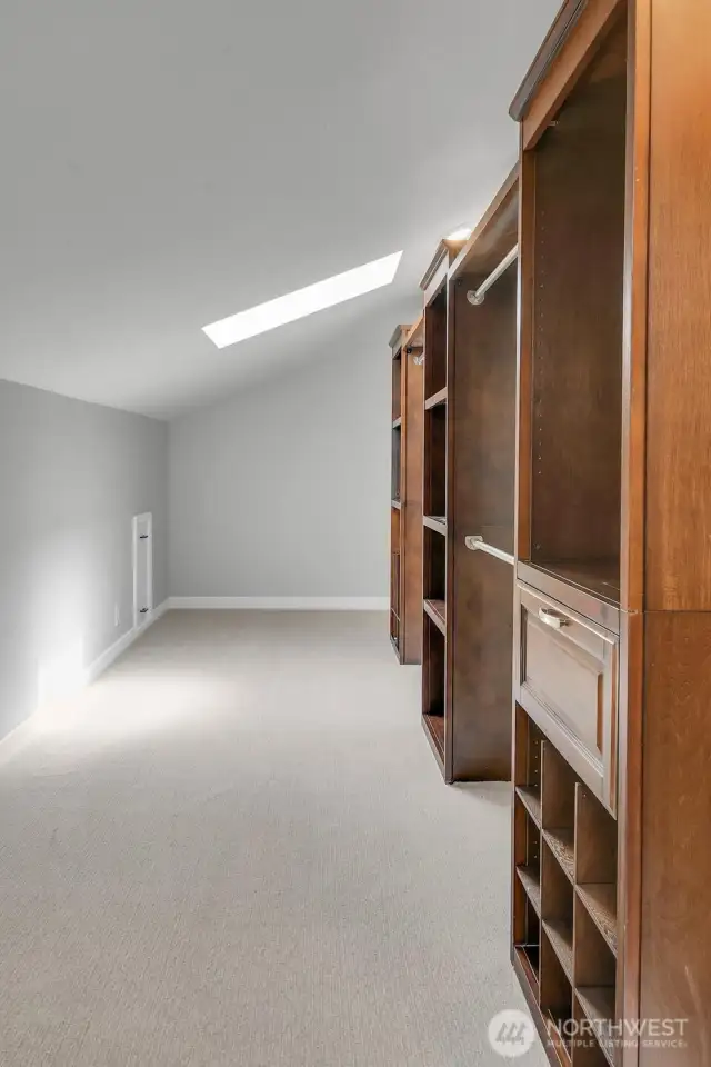 ....and there's even MORE closet space with a skylight and more built ins!