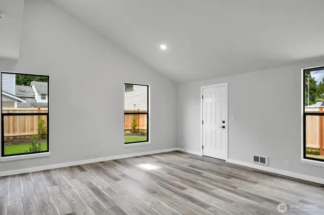 Vaulted ceilings and abundant windows fill this spacious ADU with natural light.