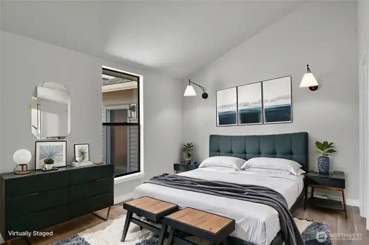 Vaulted ceiling in the ADU bedroom provides a sense of space and architectural interest. Walk-in closet to the right not shown. Virtually staged.