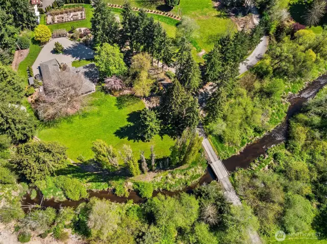 A rare Redmond Acreage Rambler on 3+ acres of peacefulness. Cross over the babbling brook to find your garden oasis where option abound.
