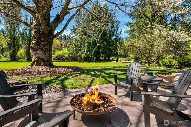 Expansive covered outdoor paver stone back patio-two large sliders as well as French Doors provide easy access.