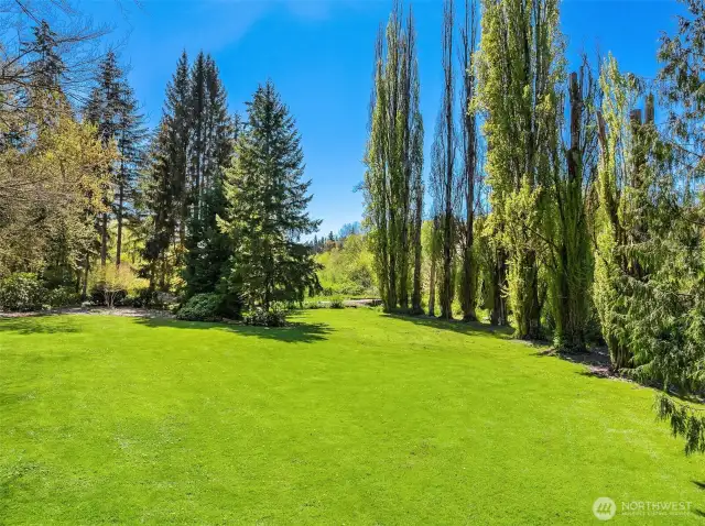 A Gardeners paradise, beautiful level lot with incredible privacy watch the salmon swim up Bear Creek from your lawn.