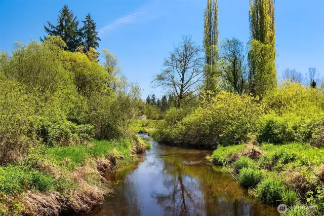 A rare Redmond Acreage Rambler on 3+ acres of peacefulness. Cross over the babbling brook to find your garden oasis where option abound.