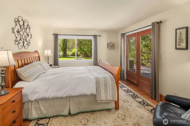 Primary suite with expansive walk-in closet and spa like bathroom with large soaking tub.