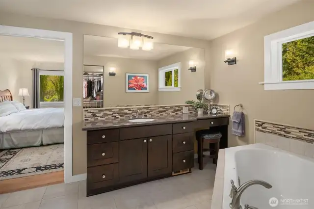 Primary suite with expansive walk-in closet and spa like bathroom with large soaking tub.