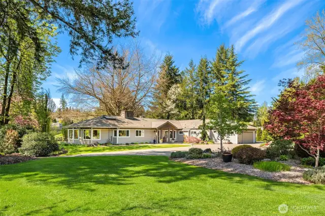 The grounds immediately surrounding the home offer a perfect combination of open, bright and sunny spaces, and a canopy of trees providing shaded areas to keep the home and outdoor living spaces cool in the Summer months.