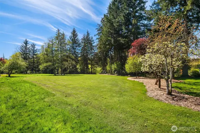 The grounds immediately surrounding the home offer a perfect combination of open, bright and sunny spaces, and a canopy of trees providing shaded areas to keep the home and outdoor living spaces cool in the Summer months.