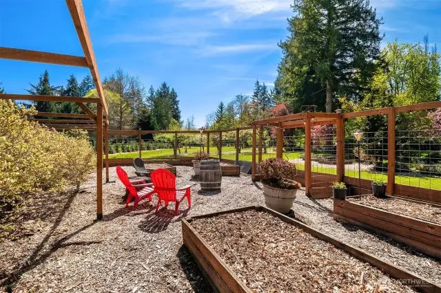 A fenced gardening area features 7 large blueberry bushes and a 16' long raised raspberry bed. The sprawling grounds are also home to 4 apple, 2 pear and an Italian Prune Tree.
