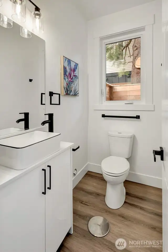 Spacious powder room on main