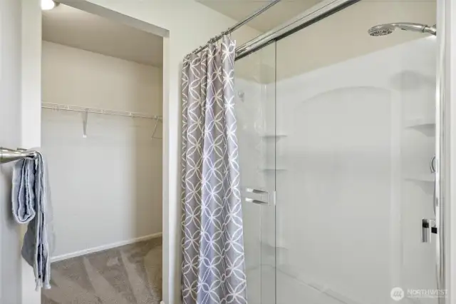 View of the primary shower, and generous walk in closet.