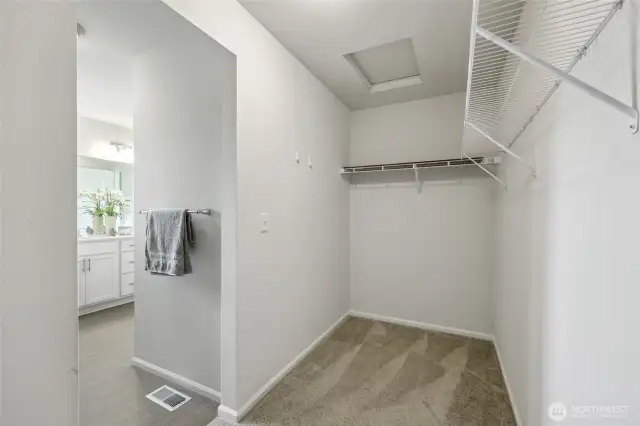 Plenty of room in this walk in closet, with even more storage not pictured.