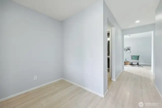 Entry, half bath and office space in view.