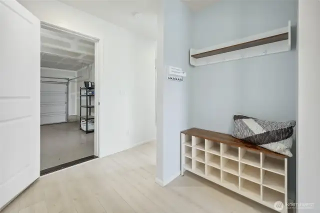 Conveniently off the garage, is perfect spot for coats, shoes, and keys! (Shoe cubby and coat rack stay)